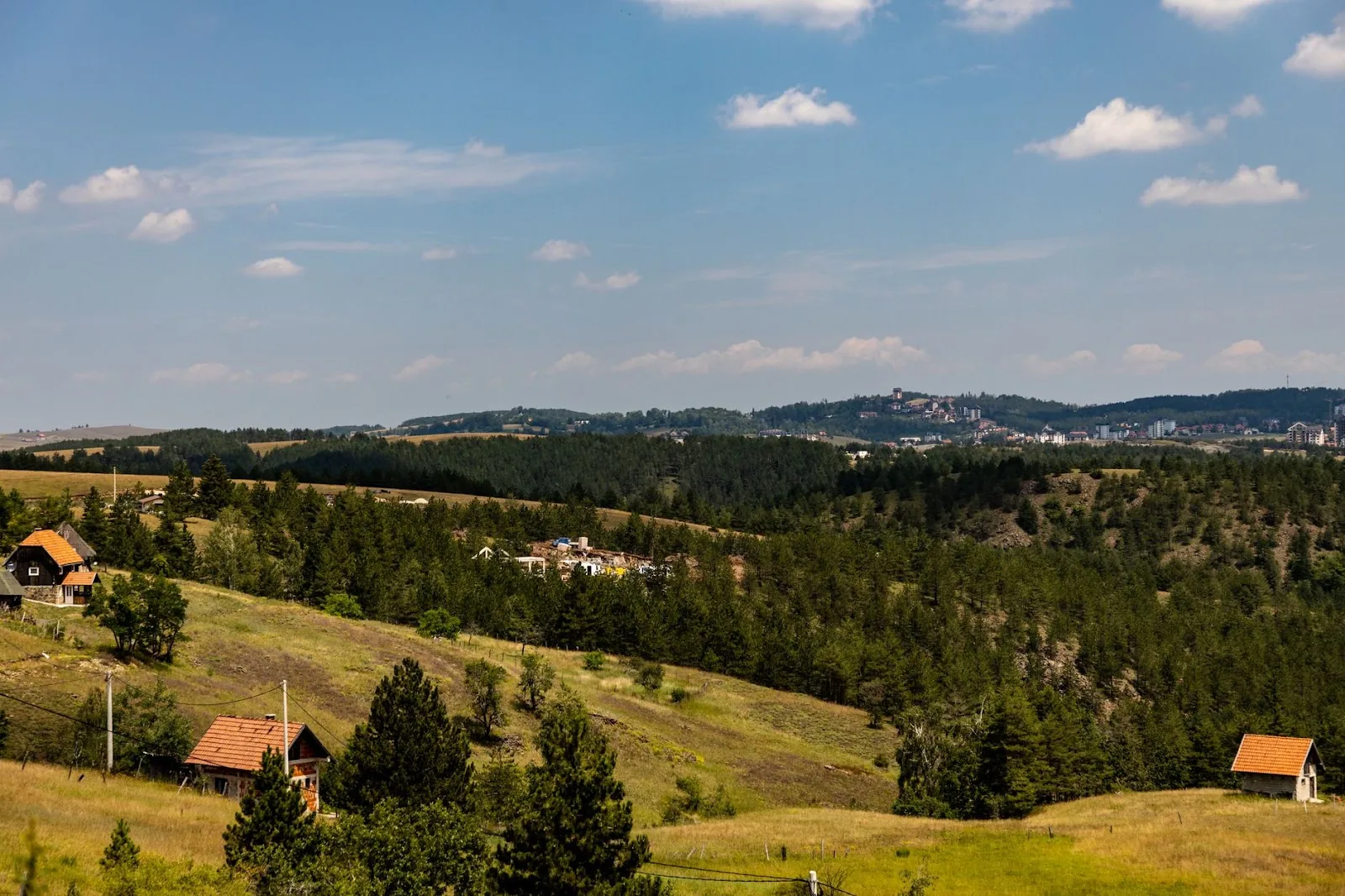 Peaceful landscape of wooded hills and distant horizon in Zlatibor, Serbia.